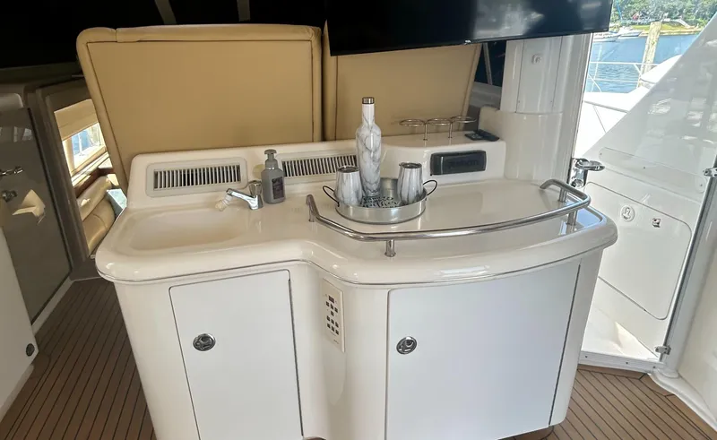 Slide: The Image of 2002 Sea Ray 480 Motor Yacht interior with sink and countertop accessories. - 12