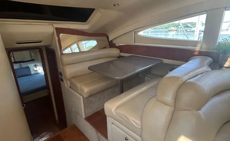 Slide: The Image of Interior of 2002 Sea Ray 480 Motor Yacht with dining area and cabin view. - 17