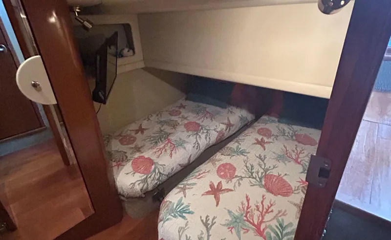 Slide: The Image of Twin beds in 2002 Sea Ray 480 Motor Yacht cabin with nautical-themed bedding. - 21