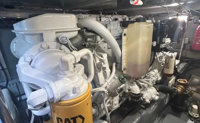 Slide: The Image of Engine room of 2002 Sea Ray 480 Motor Yacht, featuring CAT components and detailed machinery. - 27