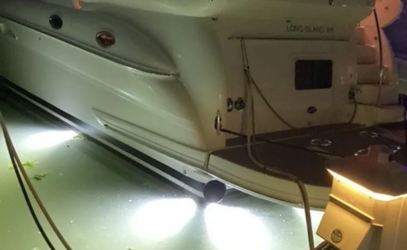 Slide: The Image of 2002 Sea Ray 480 Motor Yacht docked at night with underwater lights. - 31