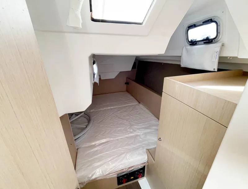 Slide: The Image of Interior cabin of 2022 Beneteau Oceanis 38.1 yacht, featuring a cozy sleeping area. - 15