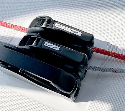 Slide: The Image of Close-up of Beneteau Oceanis 38.1 sailboat rigging, featuring labeled spinnaker halyard and outhaul. - 19