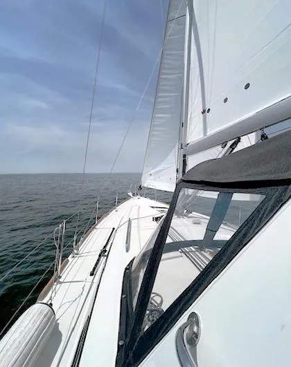 Slide: The Image of Sailing on a 2022 Beneteau Oceanis 38.1 yacht, open sea view. - 3