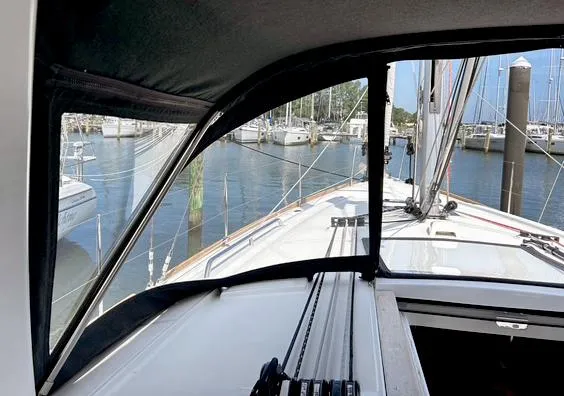 Slide: The Image of Beneteau Oceanis 38.1 sailboat cockpit view, 2022 model, docked in a marina. - 5