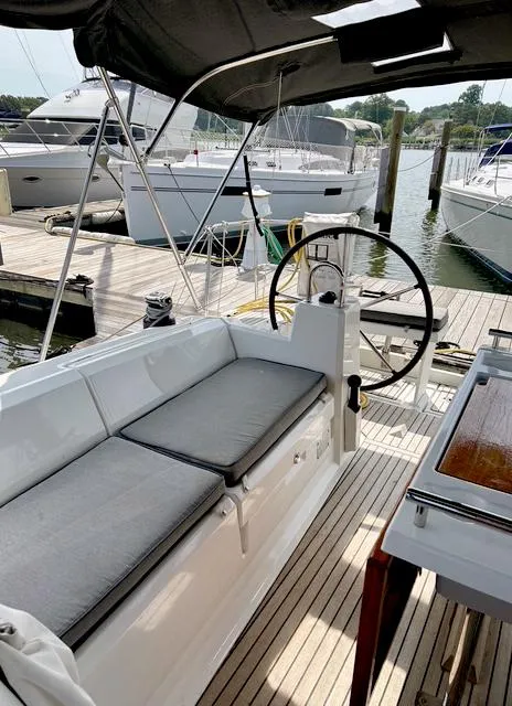 Slide: The Image of Beneteau Oceanis 38.1 sailboat cockpit with seating, docked at marina, 2022 model. - 8