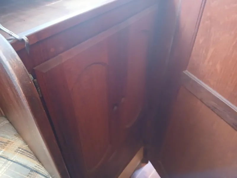 Slide: The Image of Wooden interior cabinet on a 1984 Newport Sailboat. - 8