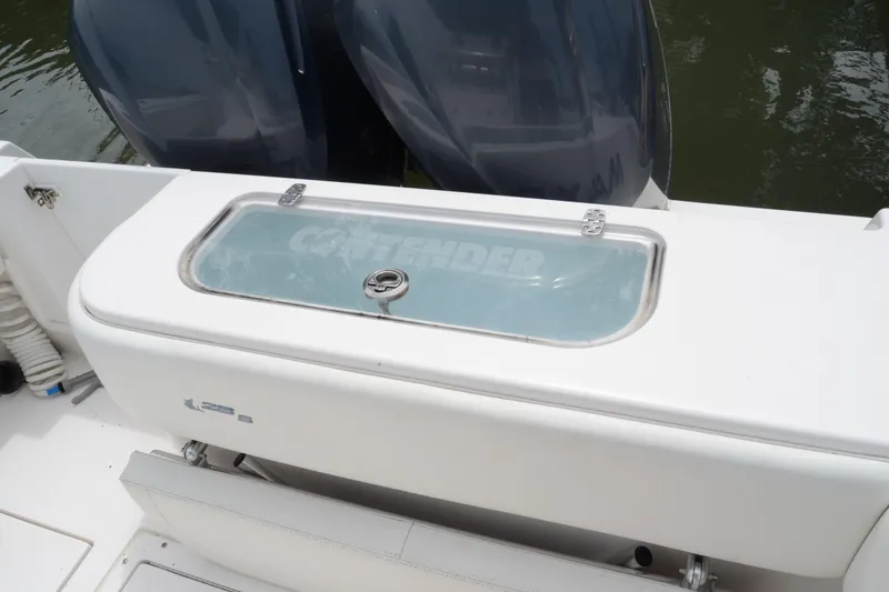 Slide: The Image of 2017 Contender 28 Sport boat with dual engines and livewell. - 11