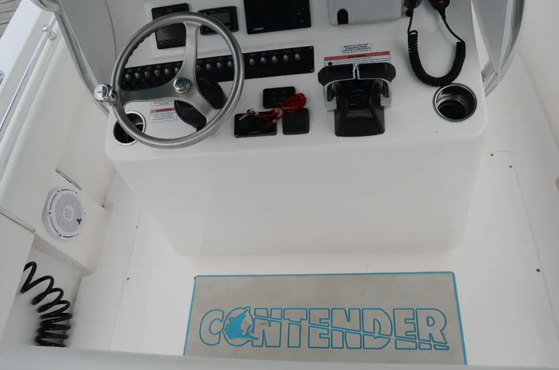 Slide: The Image of 2017 Contender 28 Sport boat console with steering wheel and controls. - 22