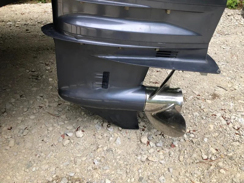 Slide: The Image of Propeller of a 2015 Parker 2530 Extended Cabin boat on gravel surface. - 16