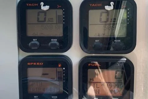 Slide: The Image of Dashboard gauges of a 2015 Parker 2530 Extended Cabin boat. - 20