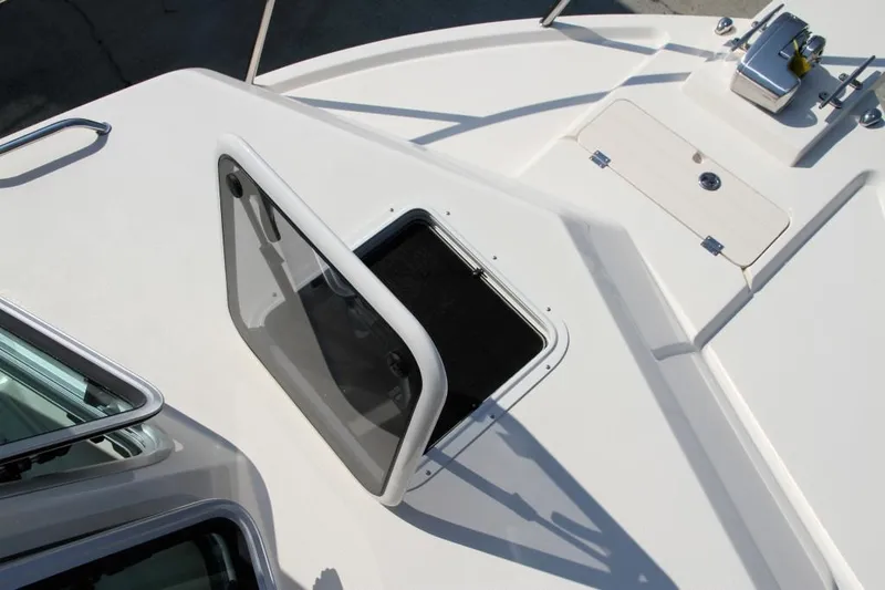 Slide: The Image of Manufacturer Provided Image: 2015 Parker 2530 Extended Cabin boat deck with open hatch. - 3