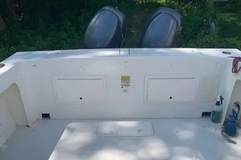 Slide: The Image of 2015 Parker 2530 Extended Cabin boat deck with dual outboard motors. - 5