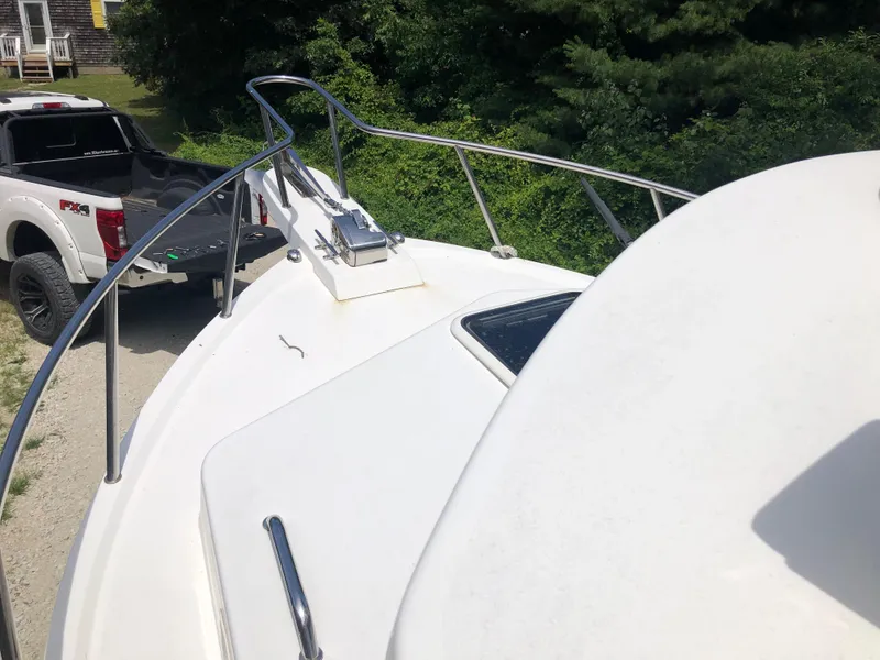 Slide: The Image of 2015 Parker 2530 Extended Cabin boat on trailer, near white pickup truck. - 6