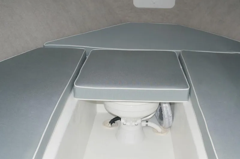 Slide: The Image of Manufacturer Provided Image: Interior of 2015 Parker 2530 Extended Cabin with cushioned seating and marine toilet. - 7