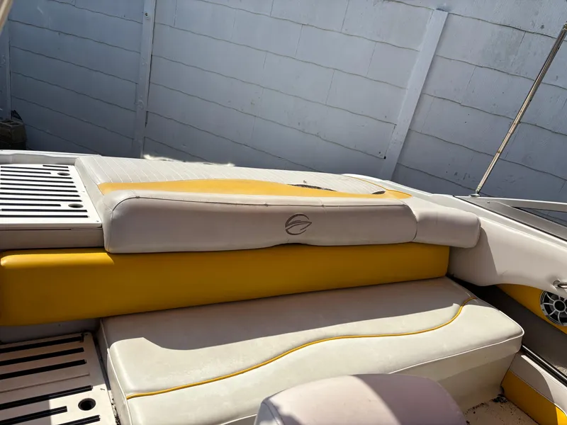 Slide: The Image of 2012 Crownline 185 SS boat interior with yellow and white seating. - 9
