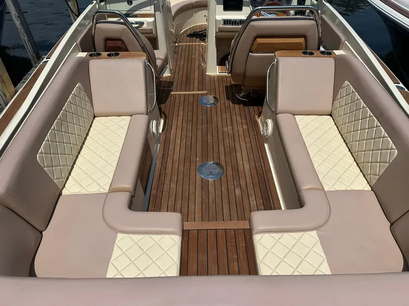 Slide: The Image of Luxurious interior of 2019 Chris-Craft Launch 30 with elegant seating and wooden flooring. - 12