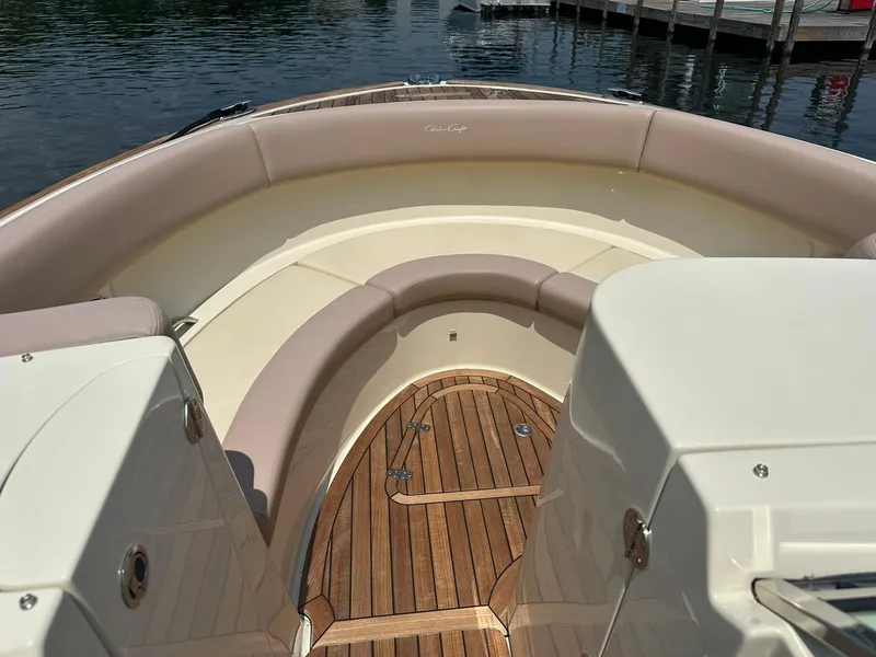 Slide: The Image of 2019 Chris-Craft Launch 30 boat interior with elegant seating and wooden deck. - 18