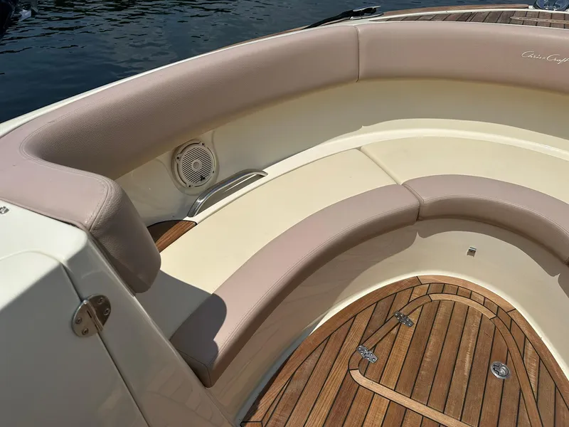 Slide: The Image of 2019 Chris-Craft Launch 30 boat interior with cushioned seating and teak flooring. - 19