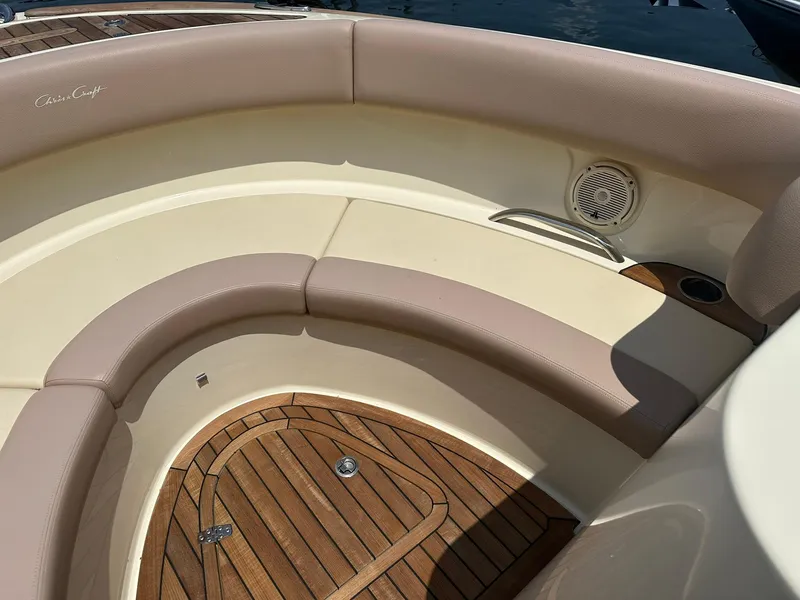 Slide: The Image of 2019 Chris-Craft Launch 30 boat interior with cushioned seating and teak flooring. - 20