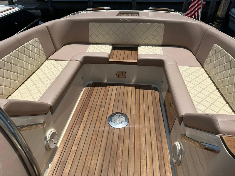 Slide: The Image of 2019 Chris-Craft Launch 30 interior with elegant seating and wooden flooring. - 26