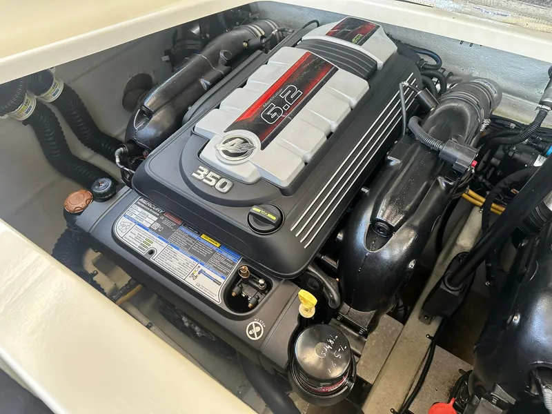 Slide: The Image of 2019 Chris-Craft Launch 30 engine compartment featuring a powerful 6.2L Mercury 350 engine. - 29