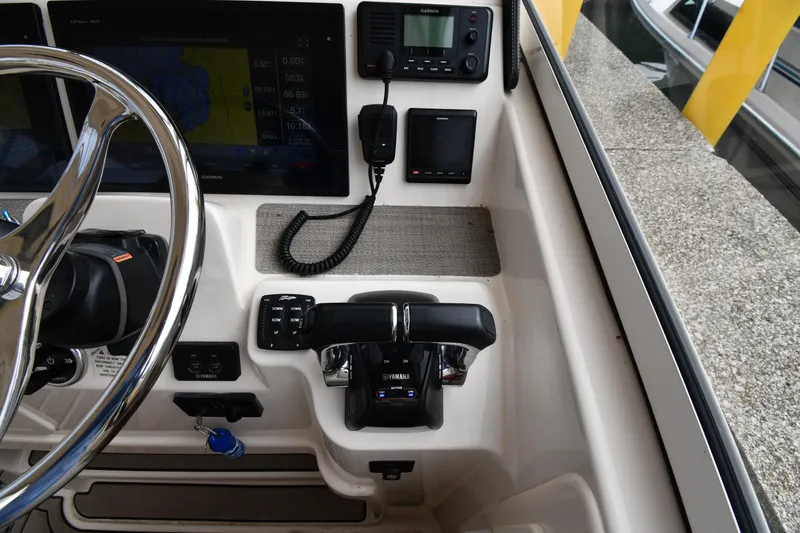 Slide: The Image of 2018 Grady-White Freedom 335 helm with Garmin navigation and Yamaha controls. - 16