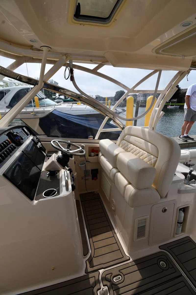 Slide: The Image of 2018 Grady-White Freedom 335 boat interior with helm and seating. - 19