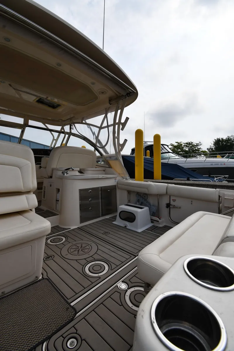 Slide: The Image of 2018 Grady-White Freedom 335 boat interior with seating and cup holders. - 22