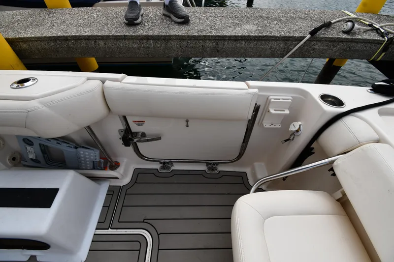 Slide: The Image of 2018 Grady-White Freedom 335 boat interior with seating and dock view. - 31