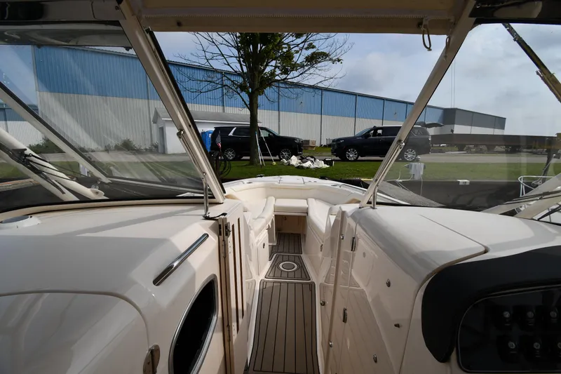 Slide: The Image of 2018 Grady-White Freedom 335 boat interior with view of dock and vehicles outside. - 34