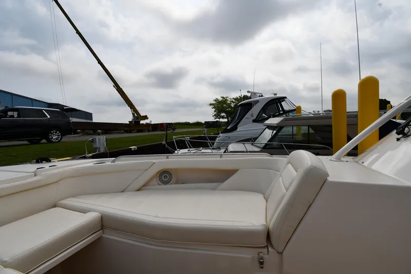 Slide: The Image of 2018 Grady-White Freedom 335 boat interior with docked yachts and crane in background. - 35