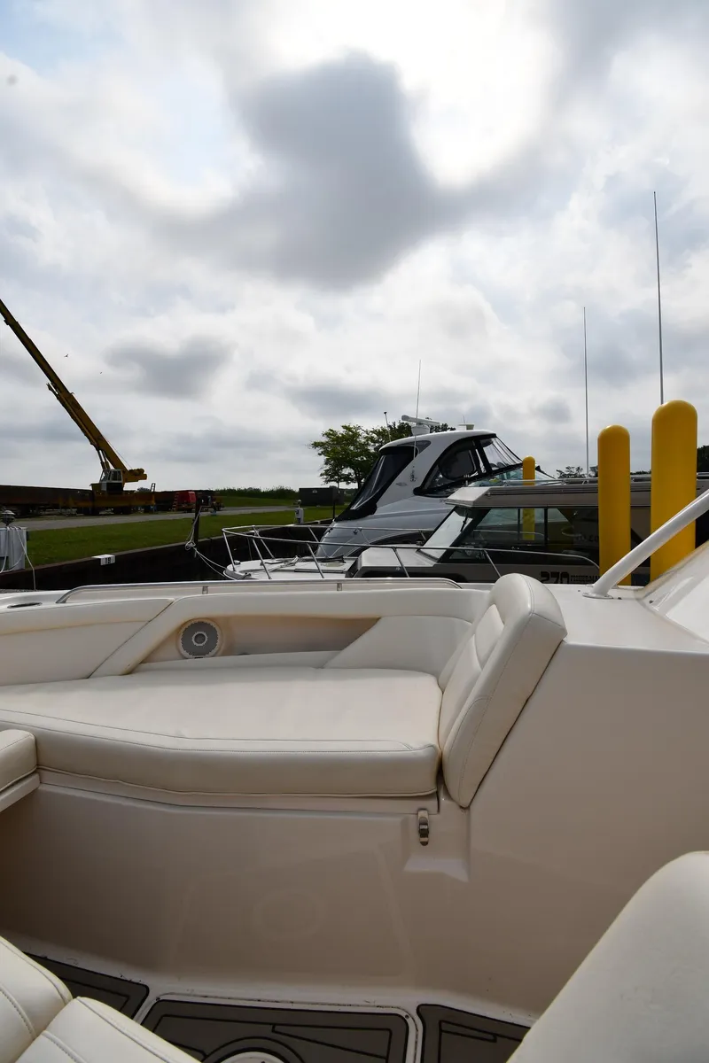 Slide: The Image of 2018 Grady-White Freedom 335 boat docked under cloudy sky. - 36