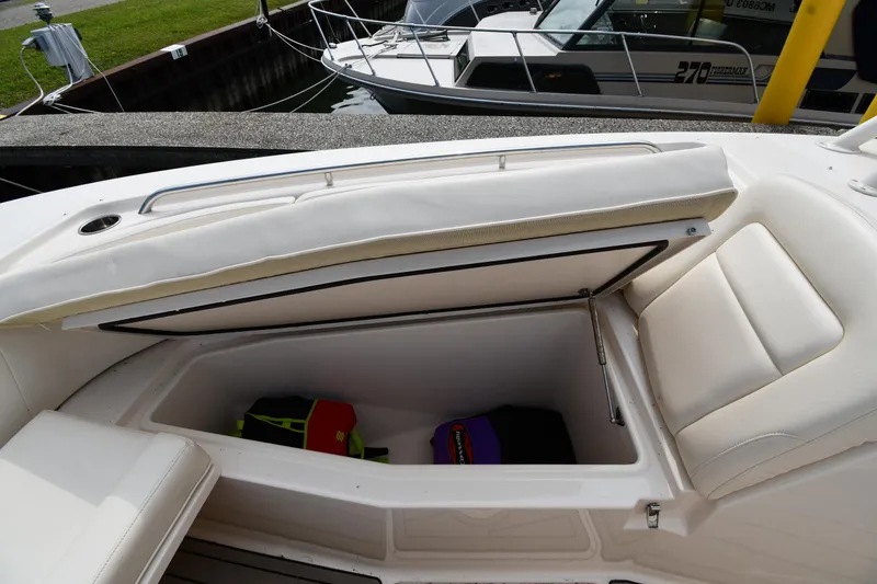 Slide: The Image of 2018 Grady-White Freedom 335 boat storage compartment with life jackets. - 41