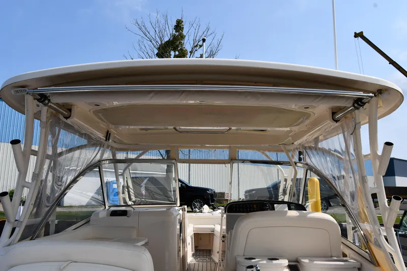 Slide: The Image of 2018 Grady-White Freedom 335 boat interior with clear canopy and seating. - 9