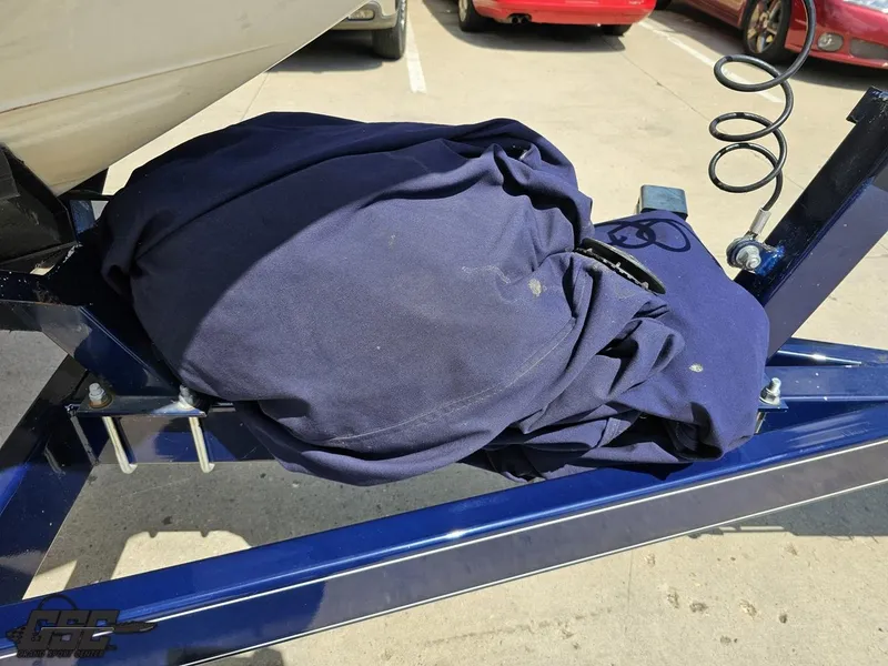 Slide: The Image of Covered Cobalt A28 boat on trailer, 2015 model, parked in sunny lot. - 11