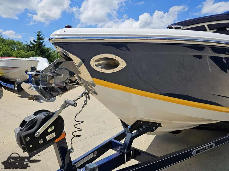 Slide: The Image of 2015 Cobalt A28 boat on trailer, sunny day, blue sky, close-up view. - 12