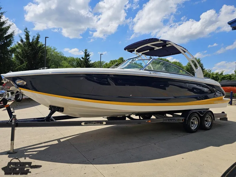 Slide: The Image of 2015 Cobalt A28 boat on trailer under blue sky with clouds. - 14