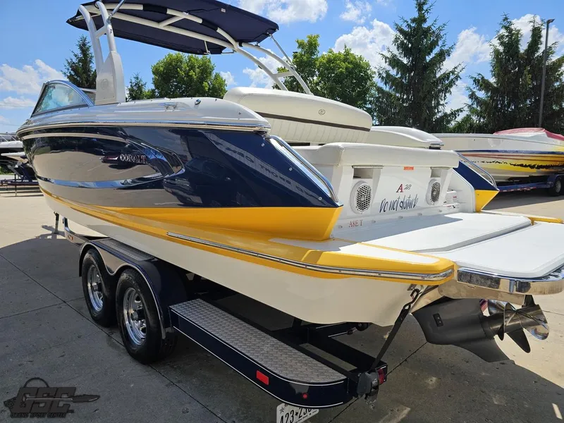 Slide: The Image of 2015 Cobalt A28 boat on trailer, featuring sleek design and vibrant yellow accents. - 21
