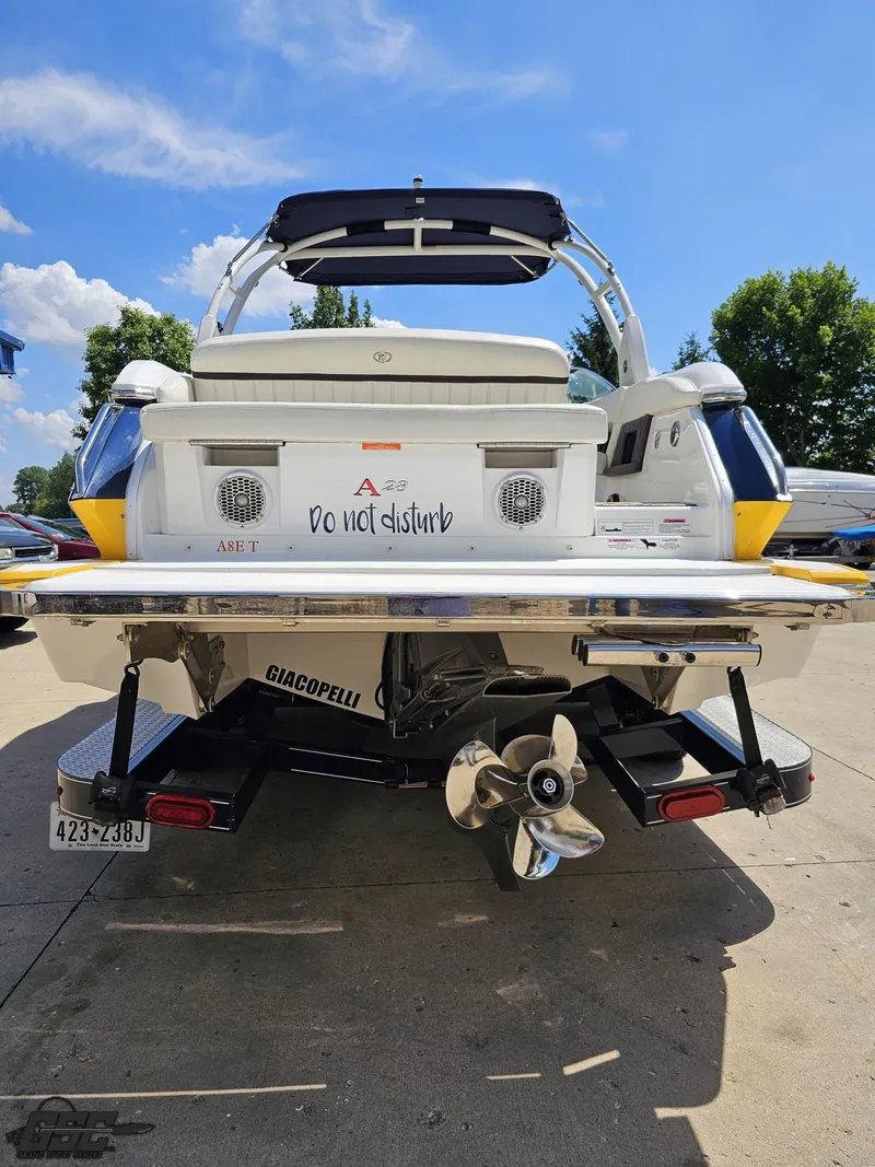Slide: The Image of Rear view of a 2015 Cobalt A28 boat with "Do not disturb" sign. - 25
