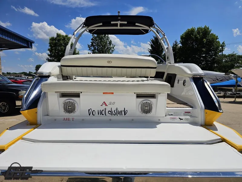 Slide: The Image of 2015 Cobalt A28 boat rear view with "Do not disturb" sign, sunny day, blue sky. - 26