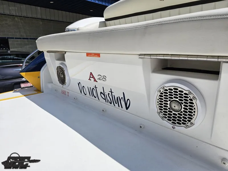Slide: The Image of 2015 Cobalt A28 boat with "Do Not Disturb" sign and speakers on deck. - 30