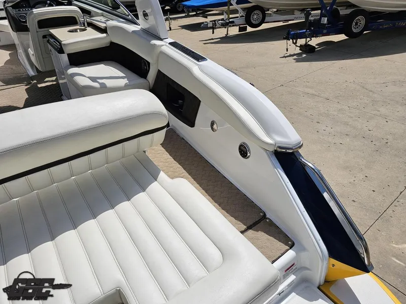 Slide: The Image of Interior of 2015 Cobalt A28 boat with white leather seating and sleek design. - 34