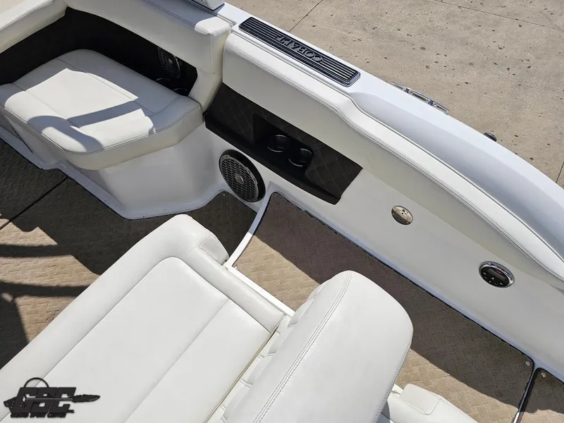 Slide: The Image of Interior of a 2015 Cobalt A28 boat with white seating and speaker system. - 40