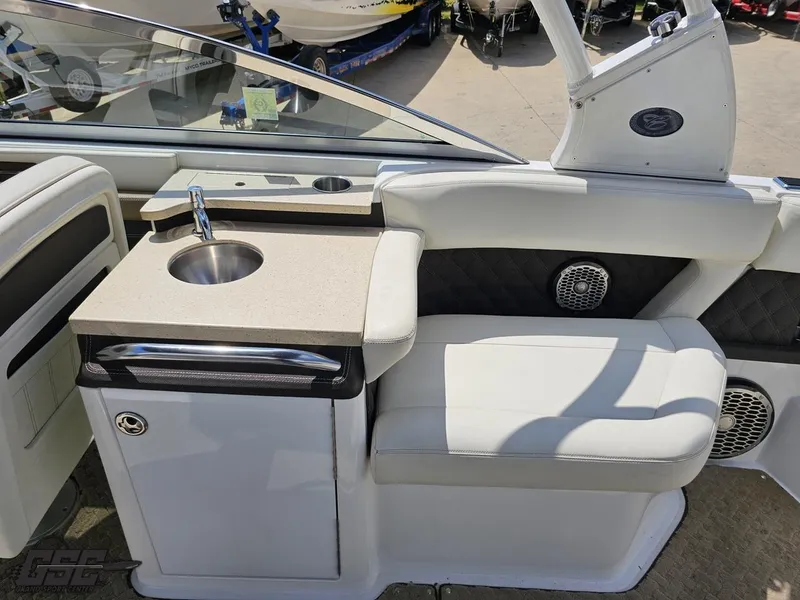 Slide: The Image of 2015 Cobalt A28 boat interior with sink, seating, and speaker system. - 41