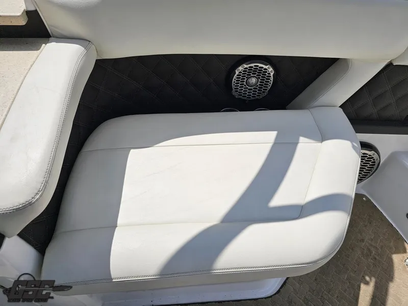Slide: The Image of White leather seat on 2015 Cobalt A28 boat with speaker and quilted black panel. - 42