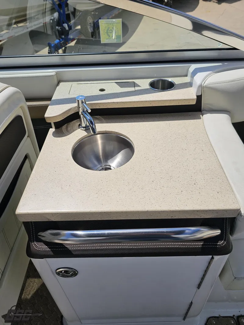 Slide: The Image of 2015 Cobalt A28 boat interior with sink and countertop. - 43
