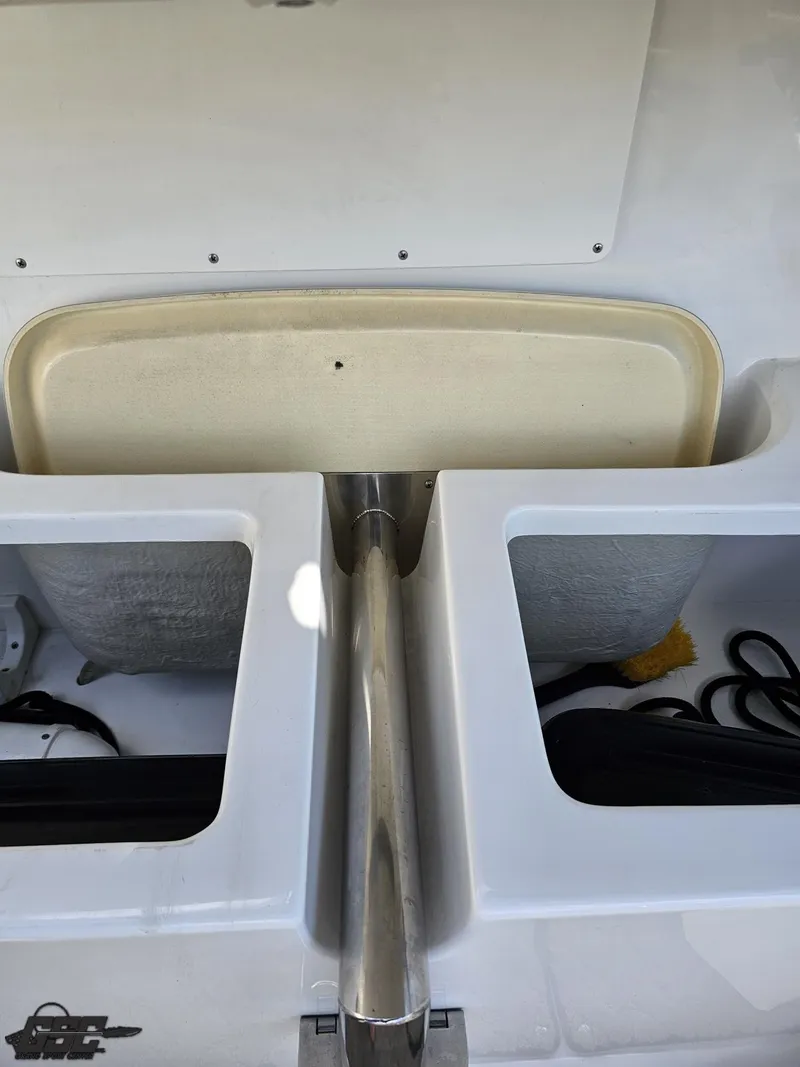 Slide: The Image of 2015 Cobalt A28 boat storage compartments with stainless steel pole and accessories. - 47