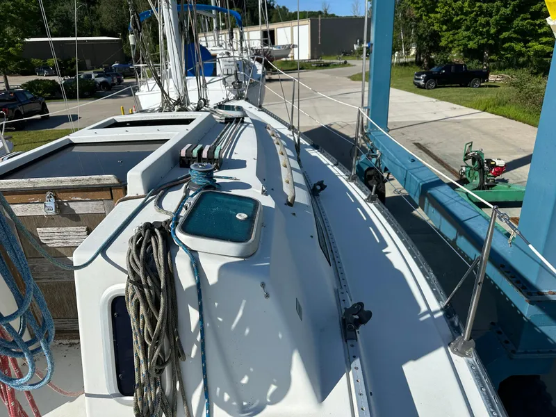 Slide: The Image of 1989 C&C 30 sailboat on a lift, showing deck and rigging details. - 20