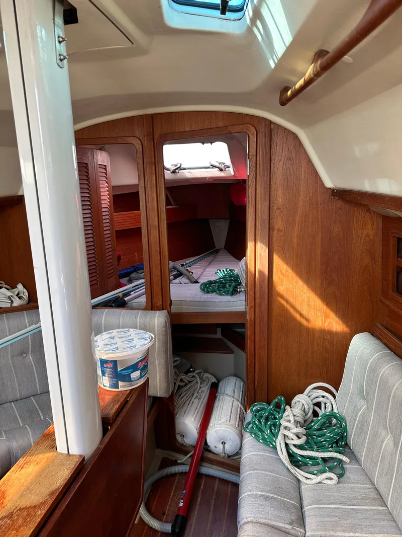 Slide: The Image of Interior of 1989 C&C 30 sailboat with ropes and nautical equipment. - 25
